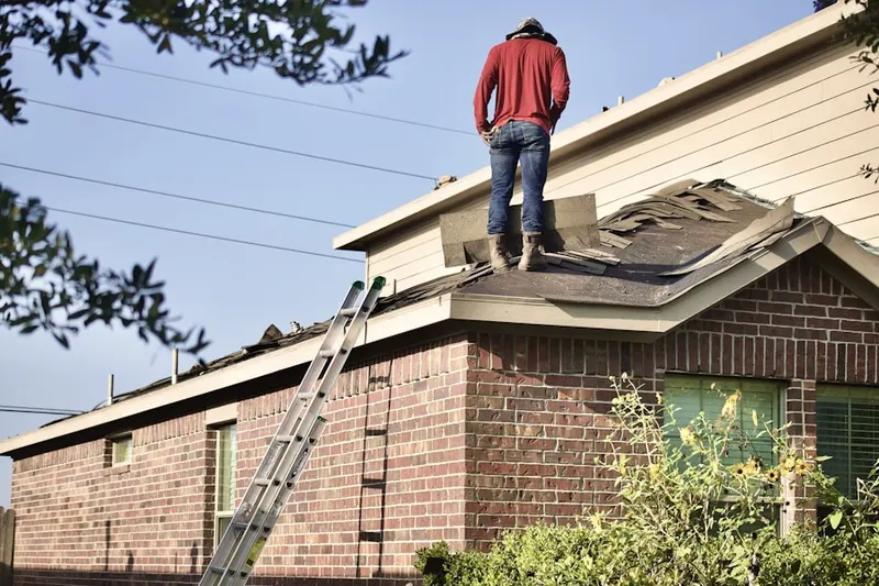 Professional roofer working on a residential roof in The Villages